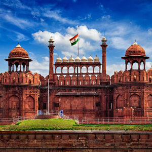 India famous travel tourist landmark and symbol - Red Fort (Lal Qila) Delhi with Indian flag - World Heritage Site. Delhi, India